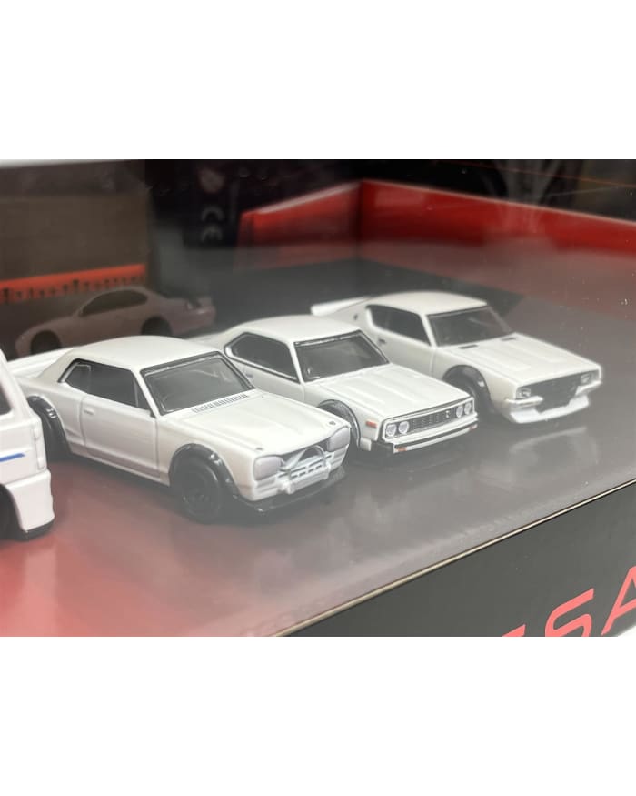 a group of white toy cars in a case