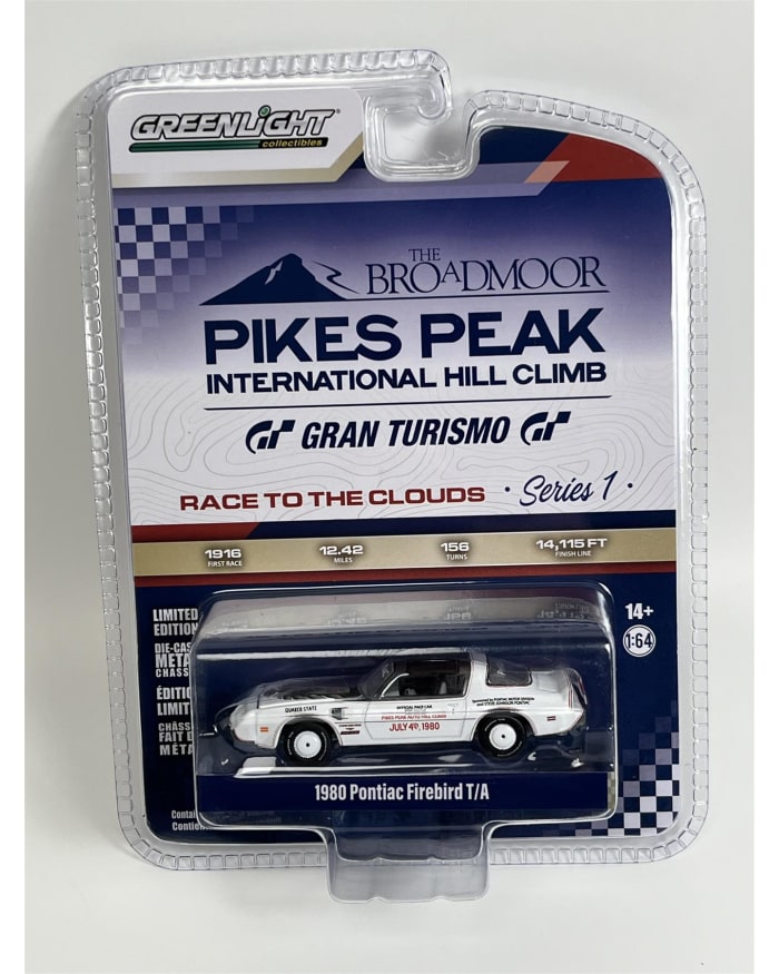 a white toy car in a package