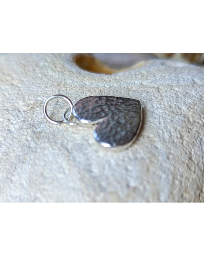 a silver heart shaped pendant