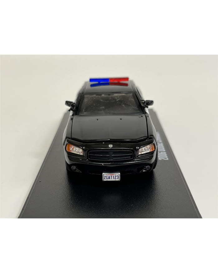 a black toy car with a blue and red light on top