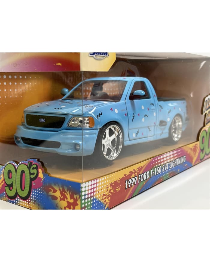 a blue toy truck in a box