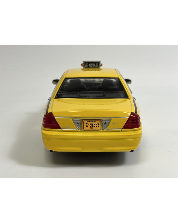 a yellow taxi car on a white background