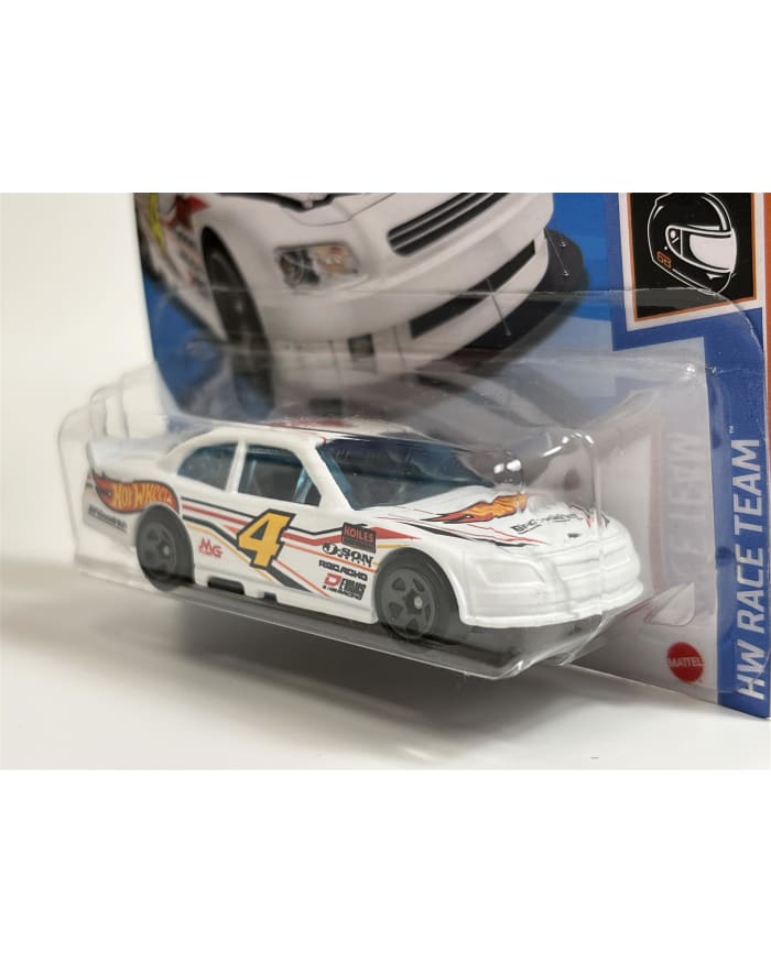 a white toy car in a package