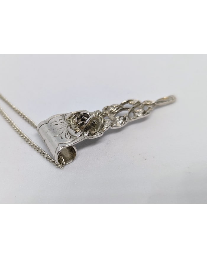 a silver object with a chain