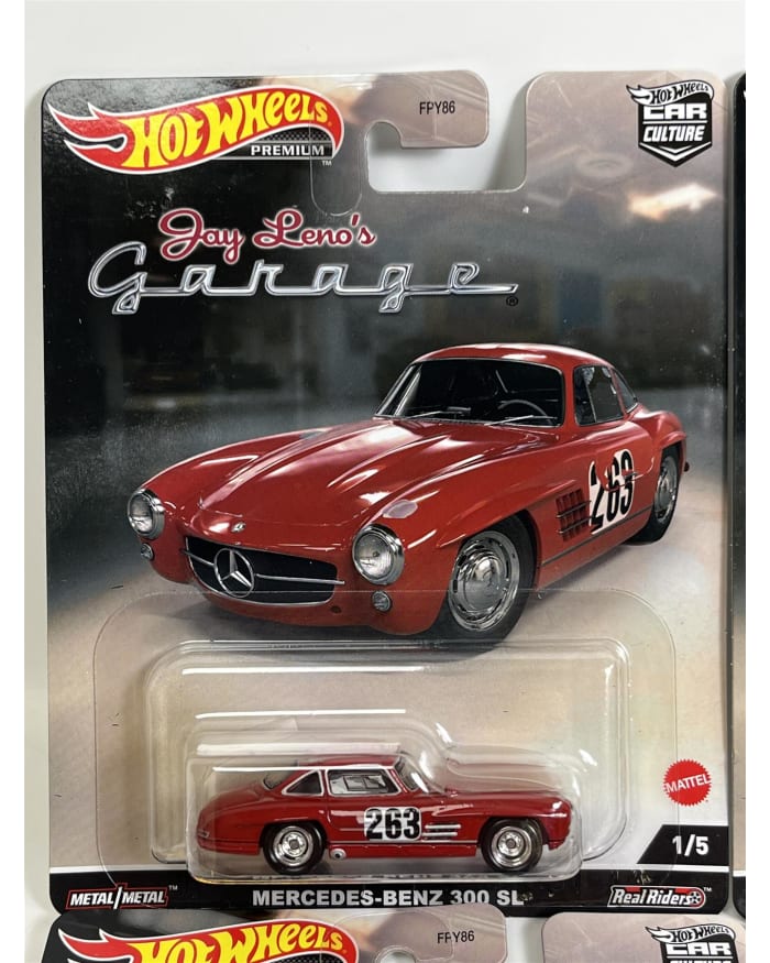 a red toy car in a package