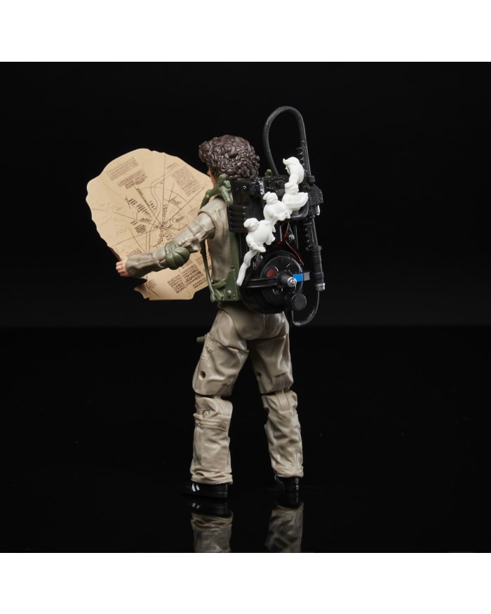 a toy figure of a man with a backpack and a map