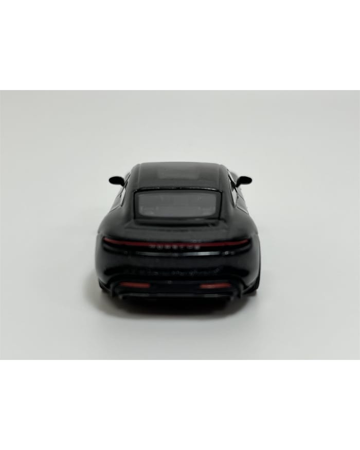 a black toy car on a white background