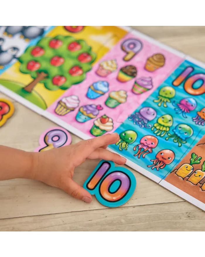 a child's hand holding a puzzle