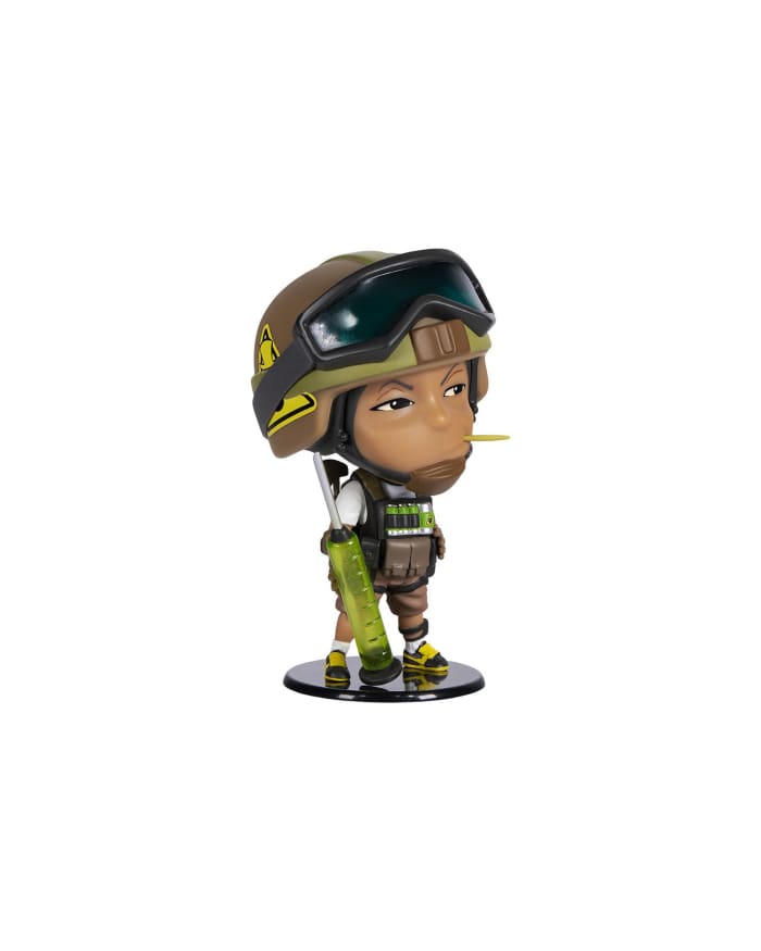 a toy figurine of a person wearing a helmet and holding a weapon