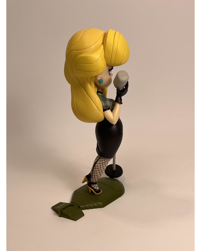 a toy figurine of a woman singing into a microphone