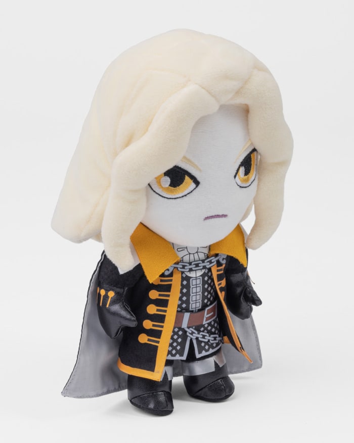 a stuffed toy with a white hair and yellow jacket