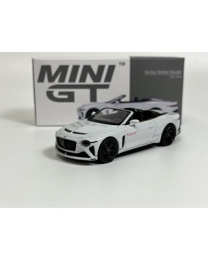 a white toy car with black wheels