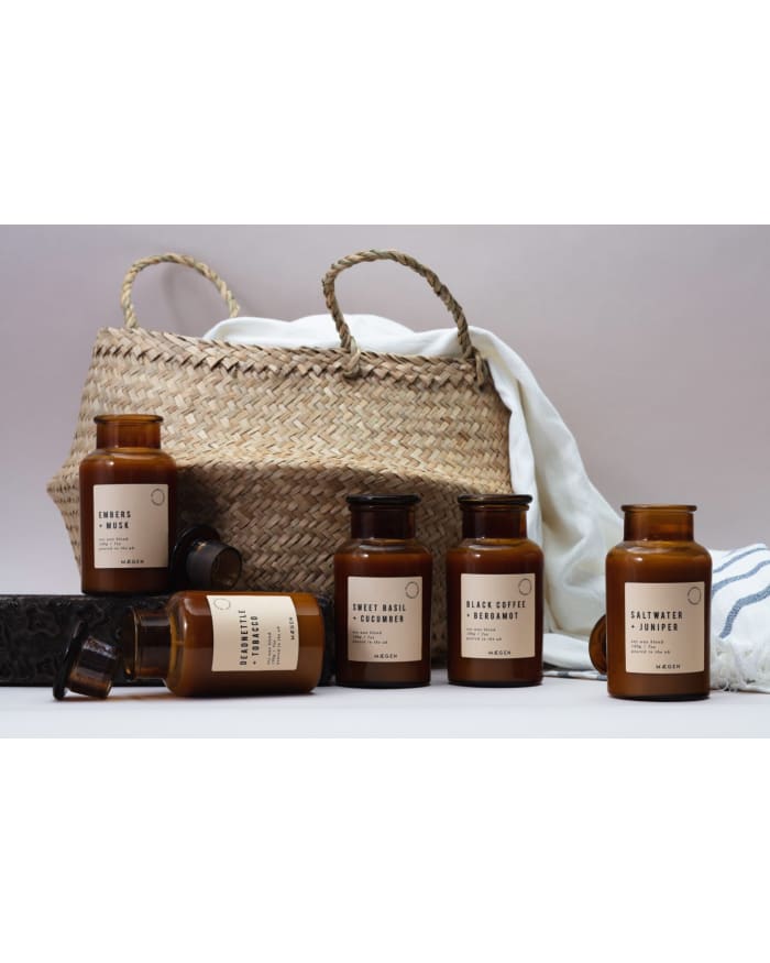 a group of brown bottles next to a wicker basket