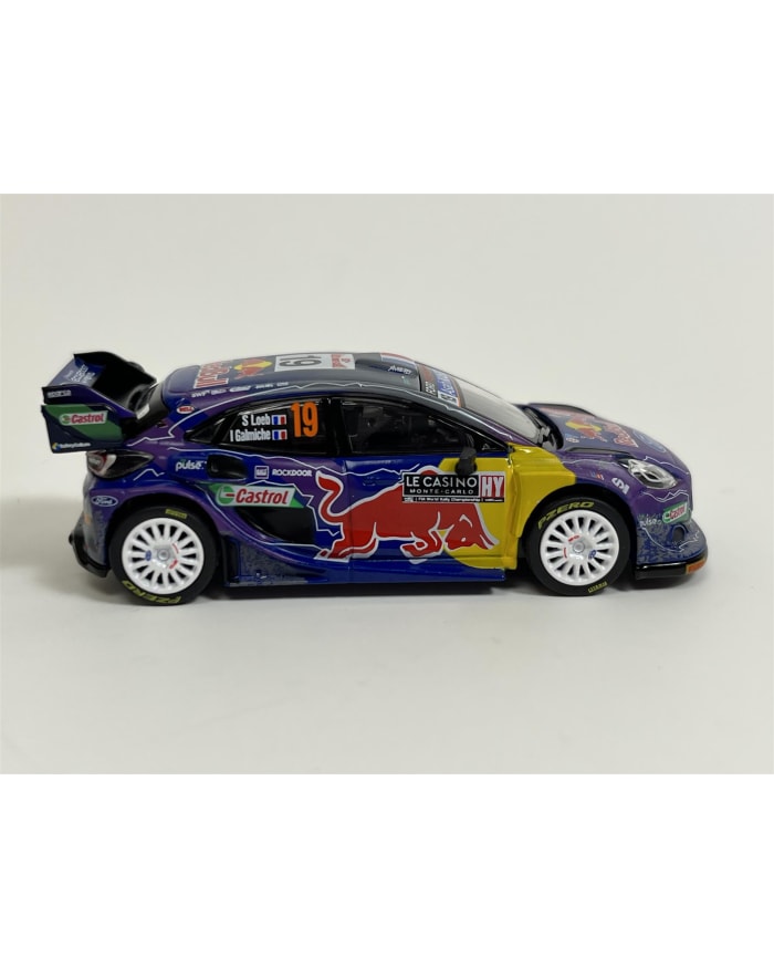 a toy car with a red bull logo on it