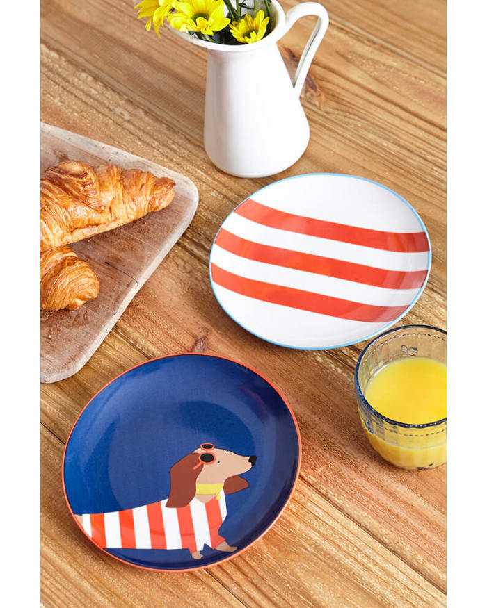 a plate and croissant on a table