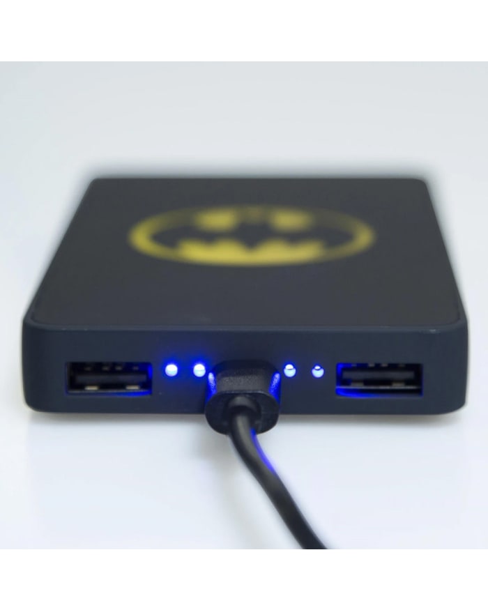 a black box with blue lights and a yellow batman logo