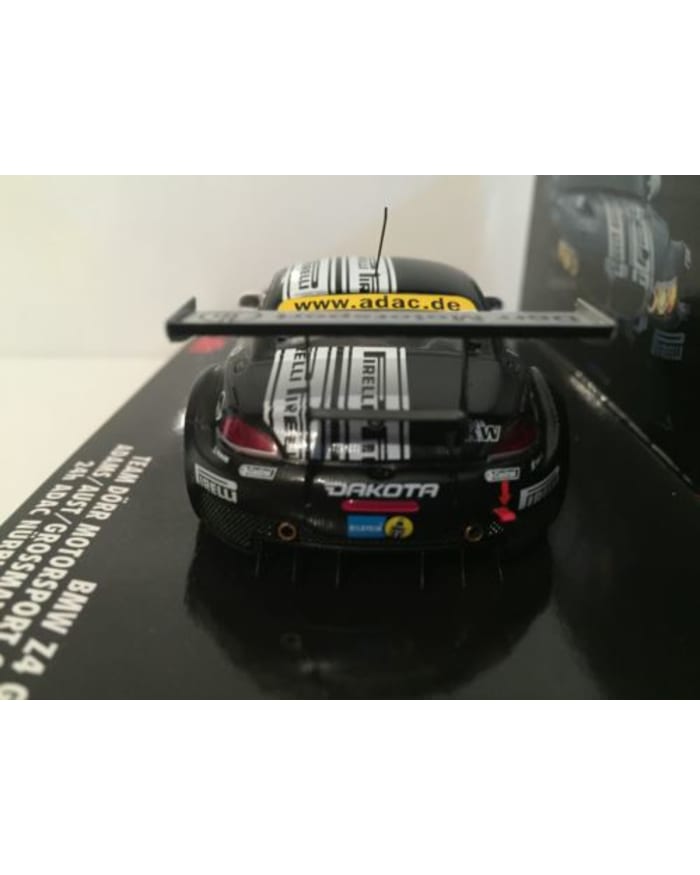 a black toy car with a large wing