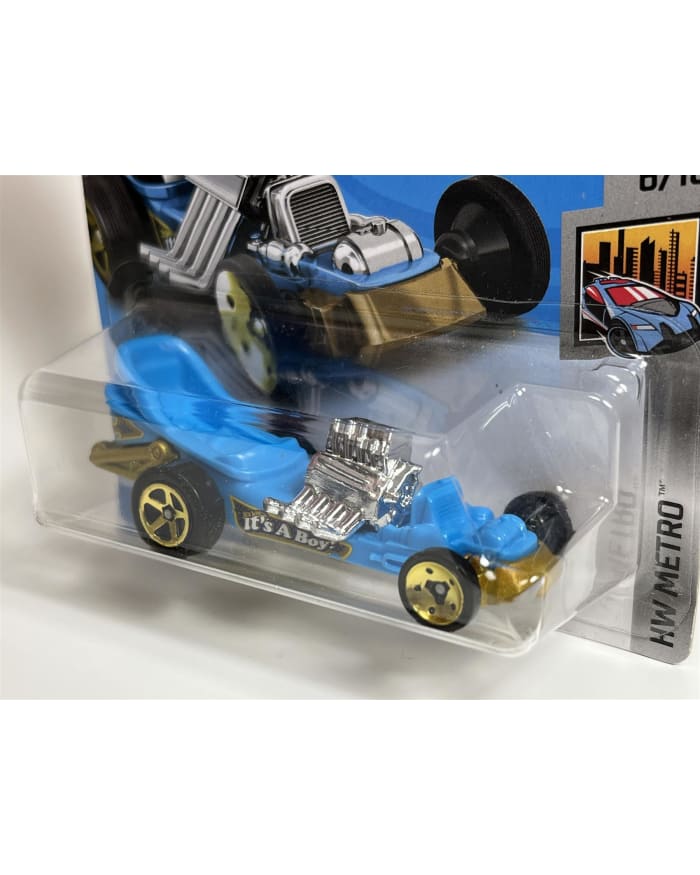 a blue toy car in a plastic packaging