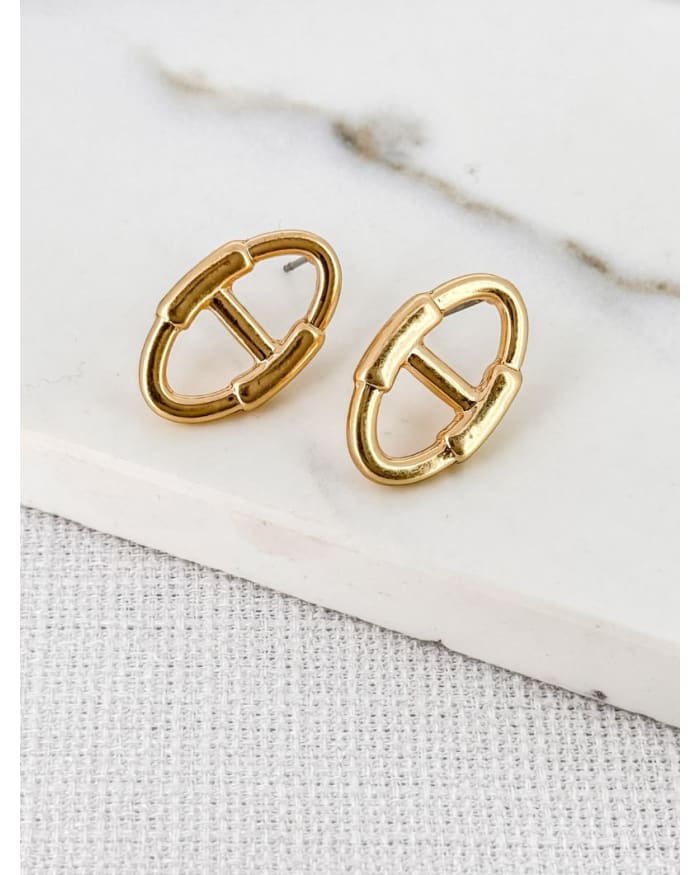 a pair of gold earrings