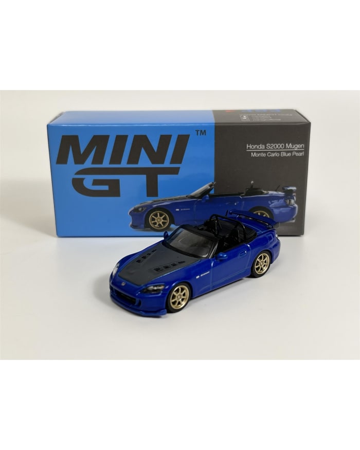 a blue toy car next to a box