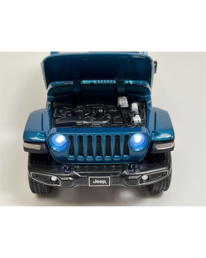 a blue jeep with its hood open