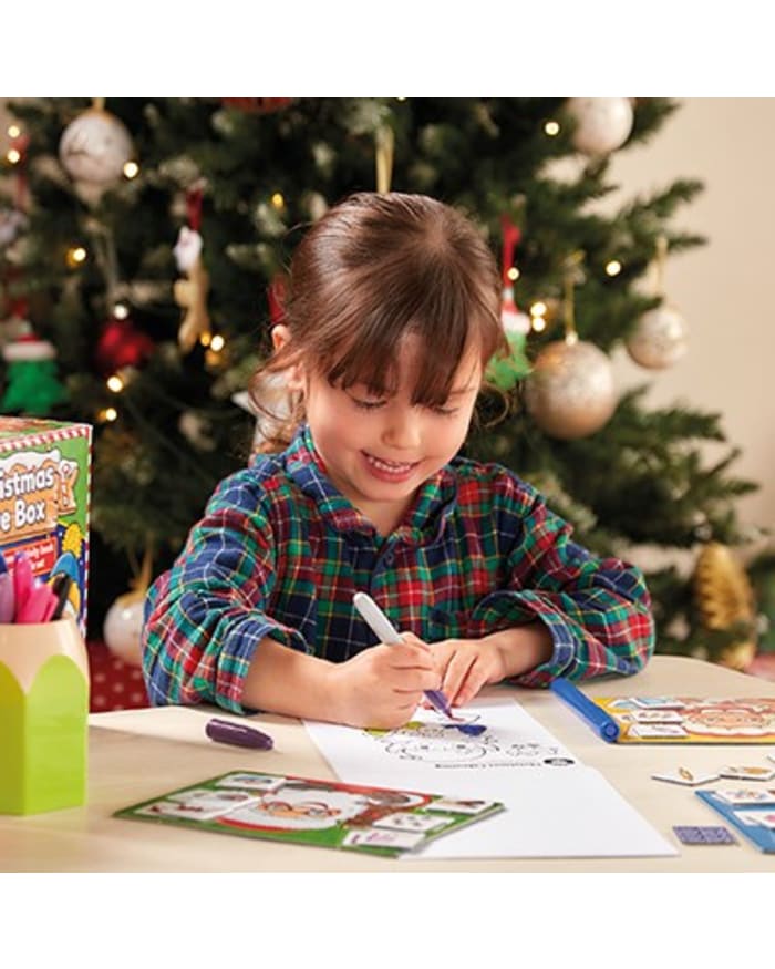 a girl coloring on a paper