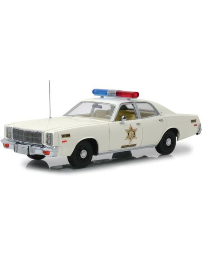 a white police car with a light on top