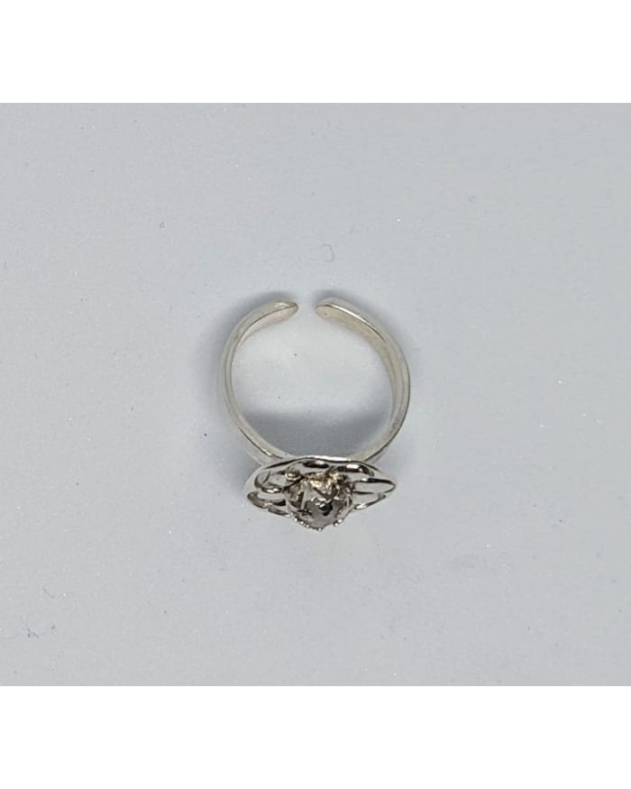 a silver ring with a face on it