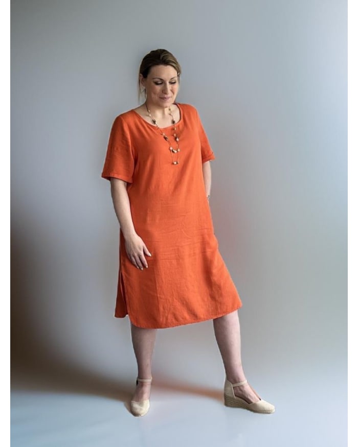 a woman in an orange dress