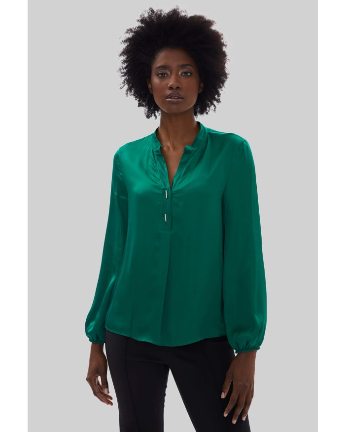 a woman in a green blouse