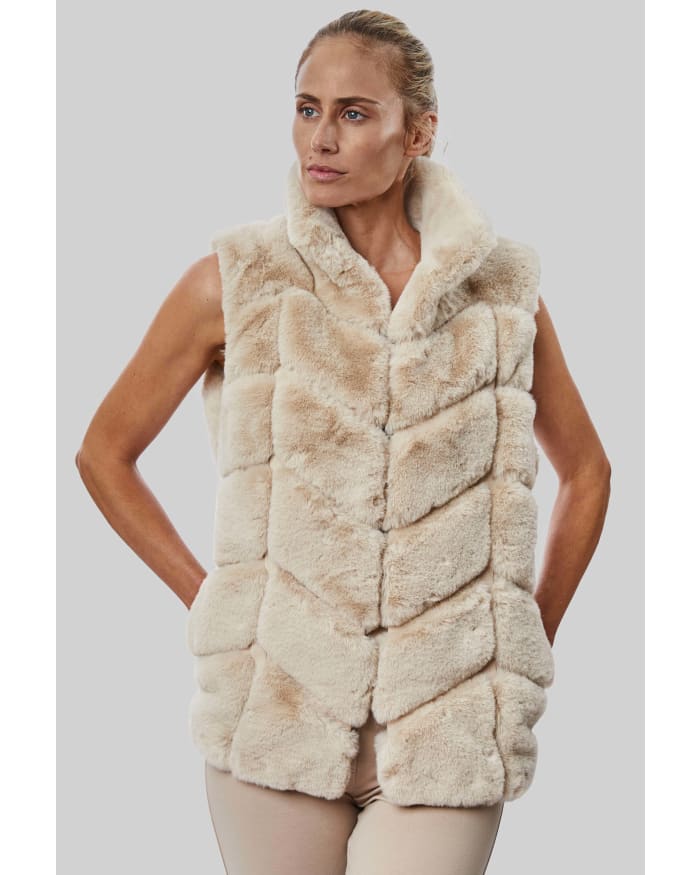 a woman in a fur vest