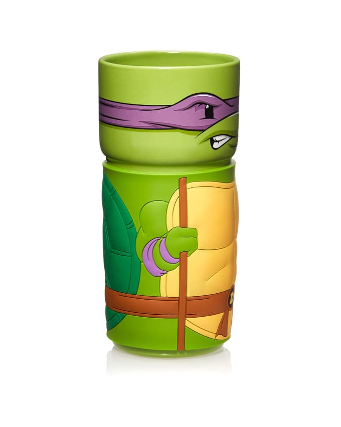 a green mug with a cartoon character on it