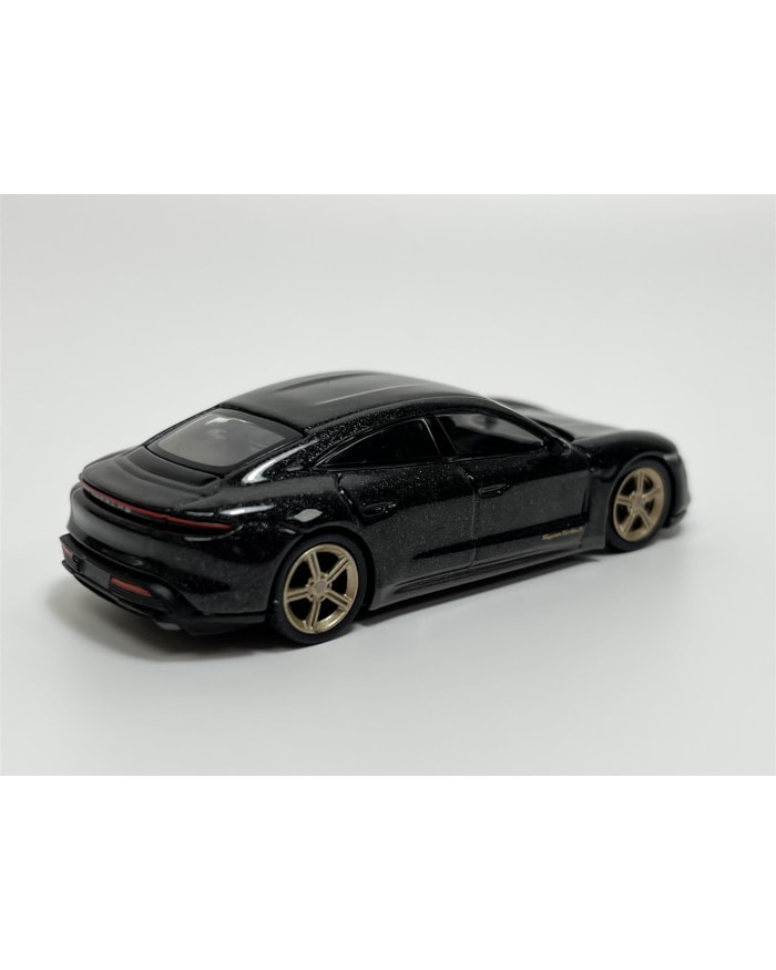 a black toy car with gold rims