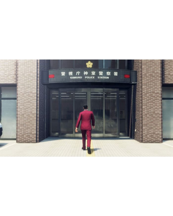 a man in a red suit walking into a building