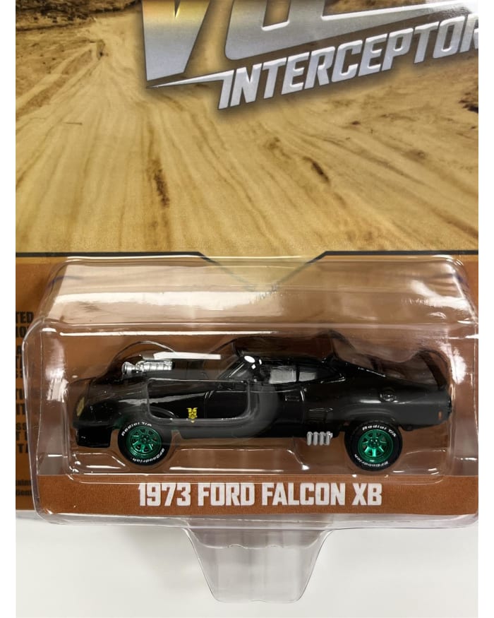 a black toy car in a package