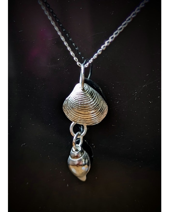 a necklace with a shell pendant