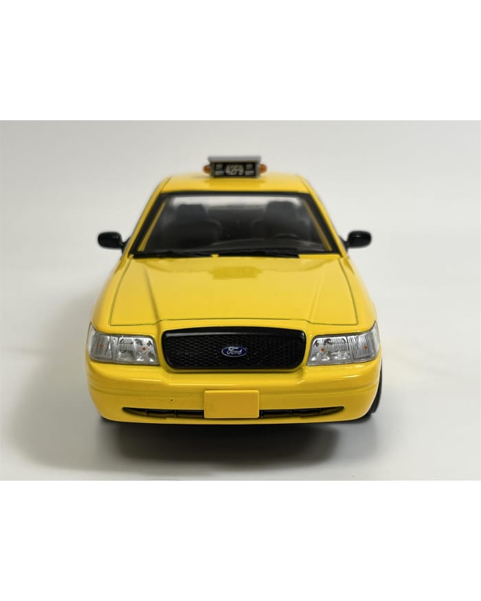 a yellow taxi car on a white background