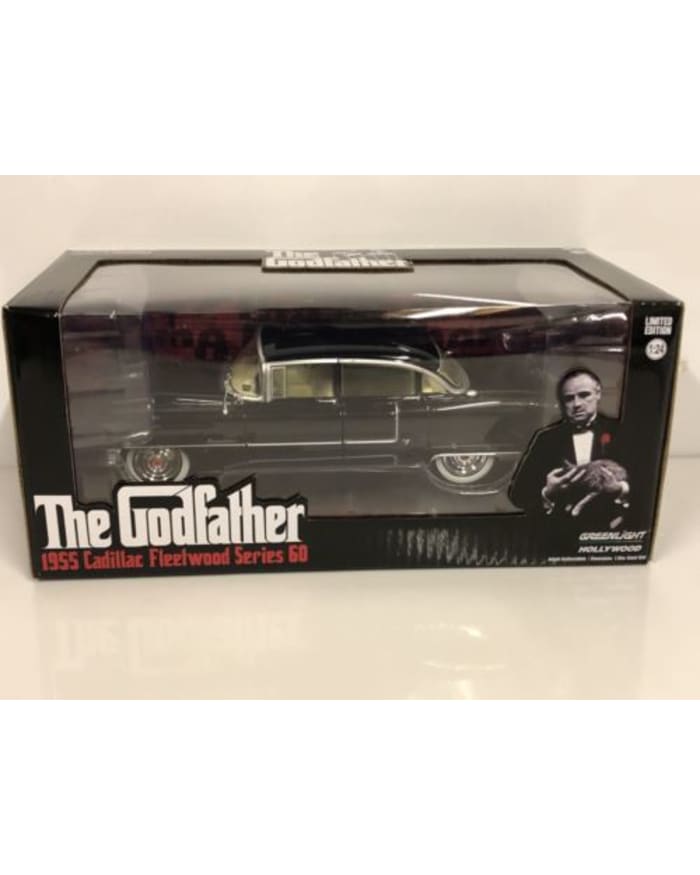 a black toy car in a box