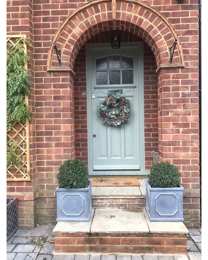 a door with a wreath on it