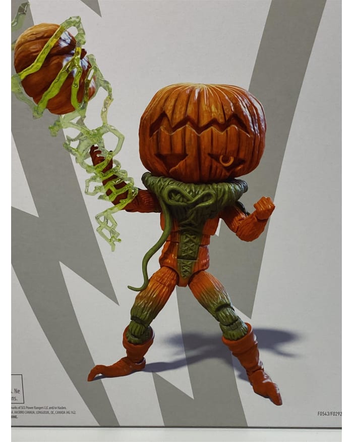 a toy figure with a pumpkin head