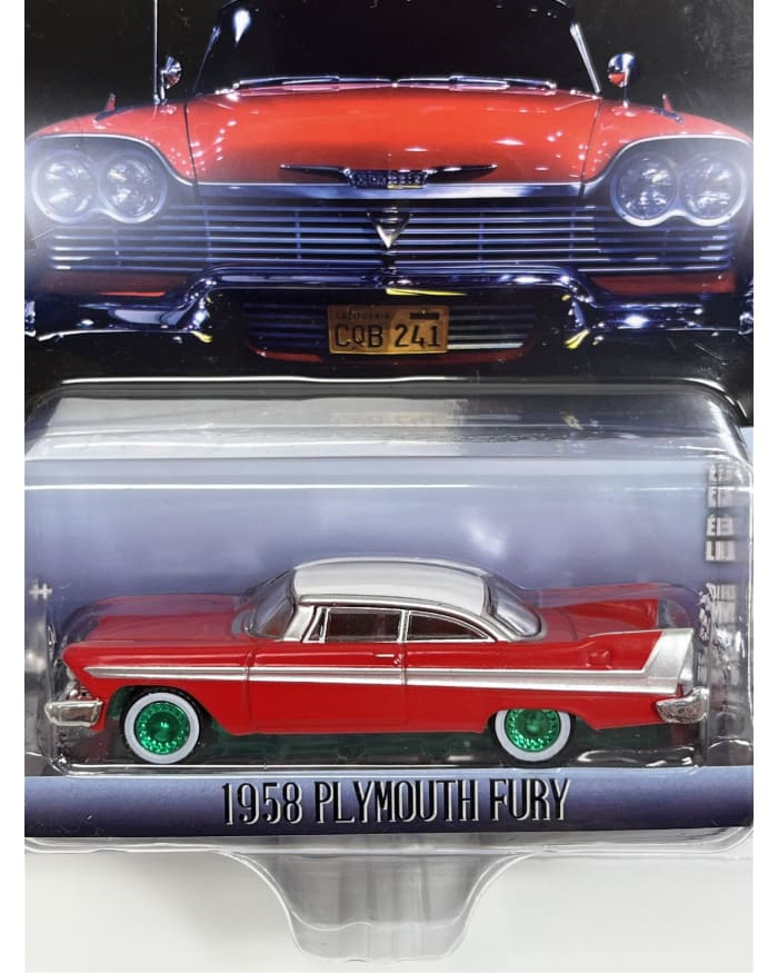 a red and white toy car in a plastic package