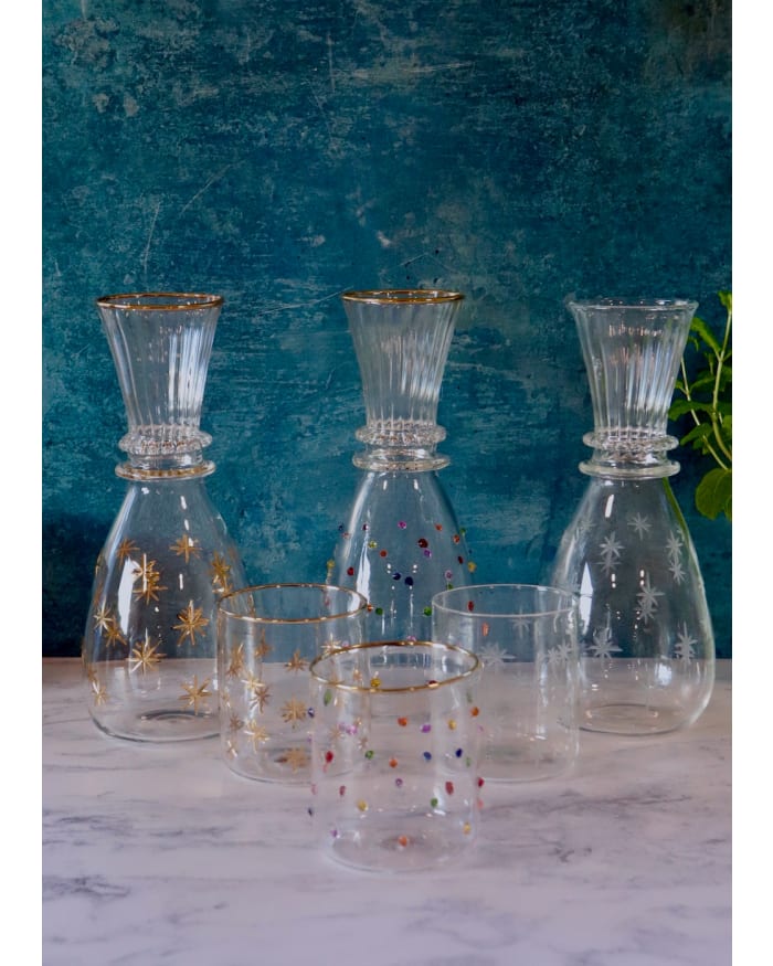 a group of glass vases and glasses