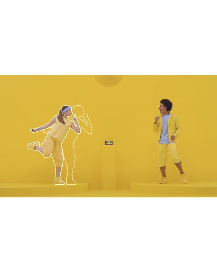 a man and woman dancing in yellow