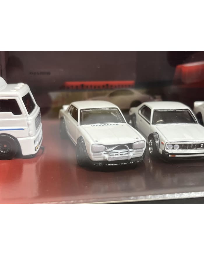 a group of white toy cars