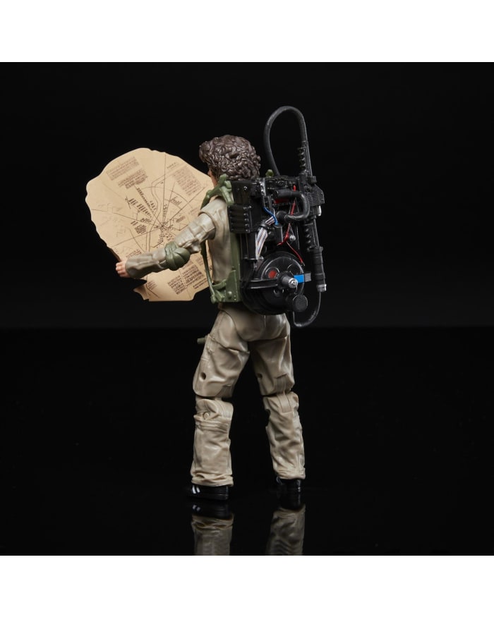 a toy figure with a backpack and a piece of paper