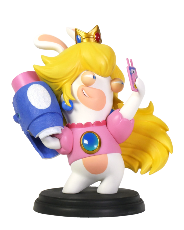 a toy figurine of a girl with a crown and a phone