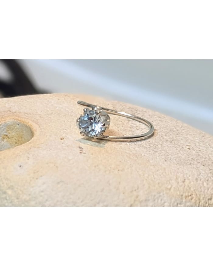 a diamond ring on a stone