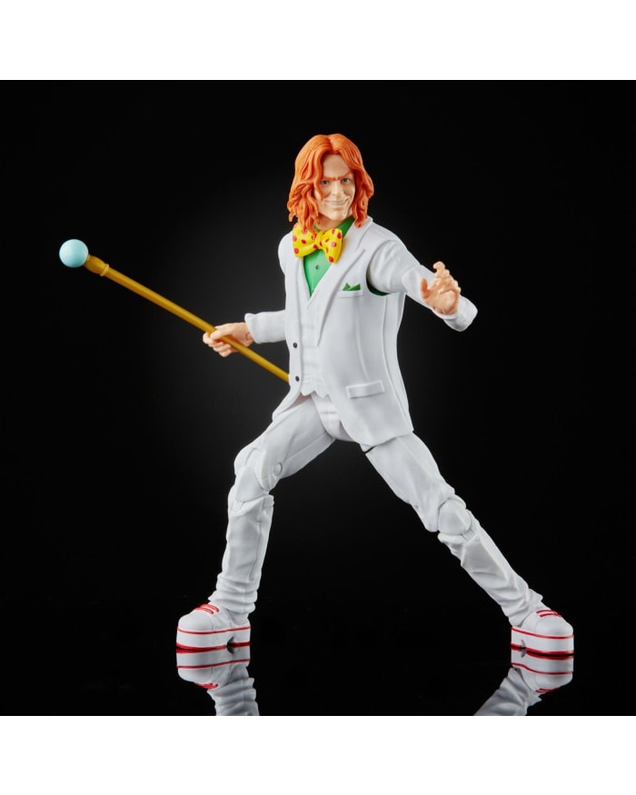 a toy figurine of a man in a white suit