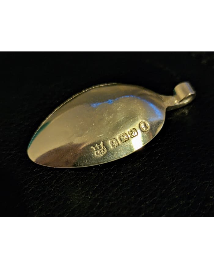 a spoon with engraved text on it