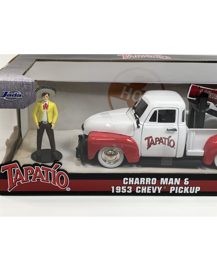 a toy truck and figurine in a box